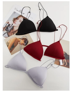 Detailed view of three French bralettes with front closure in black, burgundy and grey
