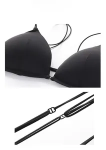Macro detail of French bralette featuring thin straps and adjustable D-ring buckles