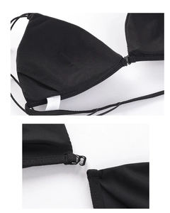 Close-up of black triangle bralette featuring front buckle closure and thin straps