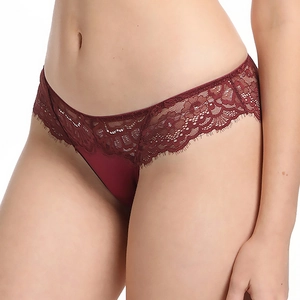 Detail of wine red lace underwear with intricate floral embroidery and eyelash trim texture