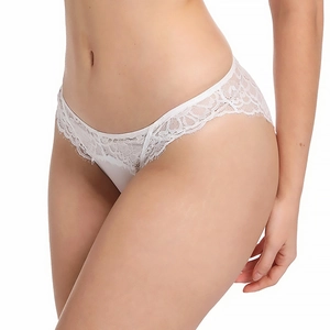 Detailed close-up of white floral lace embroidery on low-waist sexy women's briefs