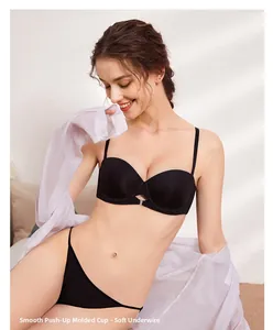 Detail of black smooth push-up lingerie set with soft underwire and molded cups