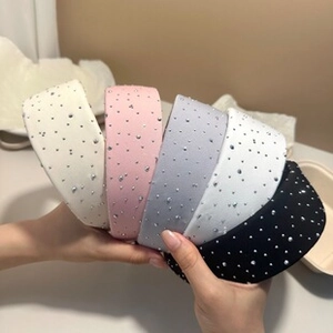 Detail of five multi-colored wide headbands with elegant pearls and sequins texture