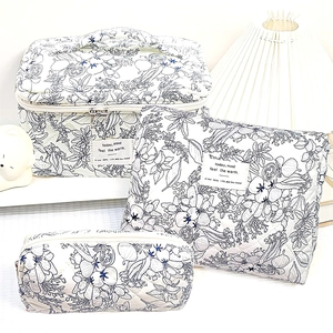 Quilted floral makeup bag set of 3 including handbag and pouches in cream cotton