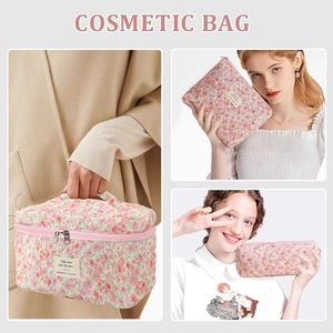 Detailed set of three floral quilted cotton cosmetic bags with handles and zippers