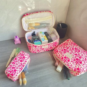 Detailed macro view of quilted floral makeup bag set with zip pocket and soft texture
