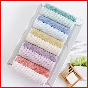 Close-up of five colorful waffle weave microfiber dry hair towels in a tray
