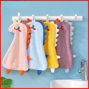 Detail of colorful dinosaur coral fleece towels with embroidery and hanging loops