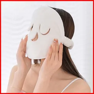 Detail of white soft coral fleece facial towel mask with eye and nose openings for kids