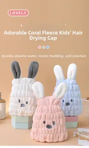 Detail of coral fleece children's hair towels with rabbit ears in pink, blue and white