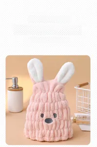 Close-up of pink rabbit microfiber hair towel with soft 3D ears and cute embroidery
