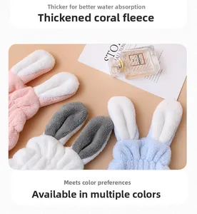 Detailed macro view of soft thickened coral fleece bunny ear hair bands in multiple colors