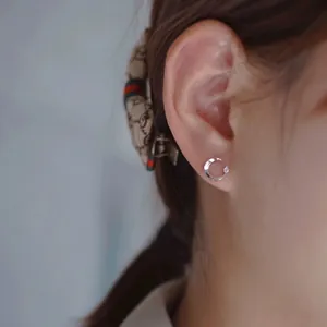 Minimalist S925 sterling silver moon stud earrings with a small cubic zirconia accent