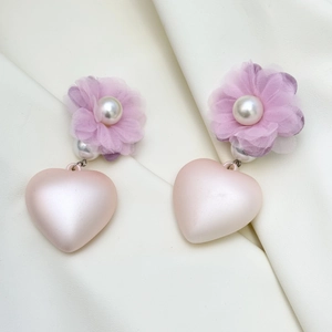 Detail of purple tulle flower earrings with white pearl and peach heart pendant
