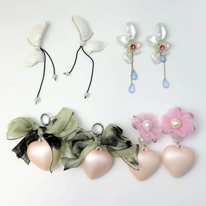 Elegant pearl and bow drop earrings set featuring heart and floral luxury designs