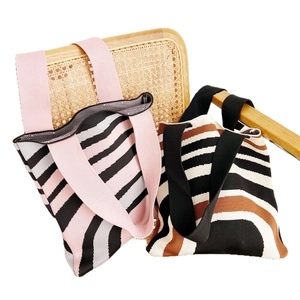 Knitted stripe tote bags in pink and brown with wide straps for casual shopping use