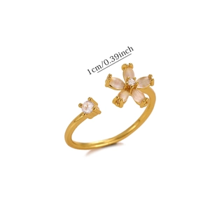 Detailed view of copper flower ring with pink opal petals and sparkling zircon setting