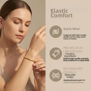 Detail of elastic gold beaded bracelet featuring high-polish irregular metallic beads