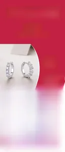 Macro detail of S925 sterling silver hoop earrings with brilliant moissanite stones