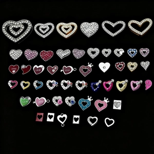 Colorful crystal heart charms with rhinestone inlay and enamel finish on black background