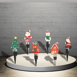 Detail of assorted Christmas wine stoppers featuring Santa, snowman, and tree designs