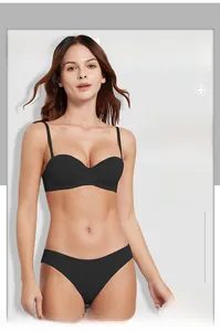Seamless black push-up bra set with matching panties featuring a smooth half-cup design