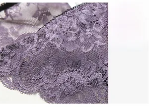 Close-up of purple lace panties showing floral embroidery and breathable mesh texture