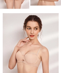 Detailed close-up of seamless skin-tone bra featuring a crystal front closure and thin straps