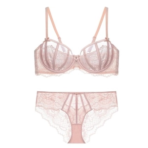 Detail view of light pink floral lace lingerie set with bow accents and soft steel ring bra