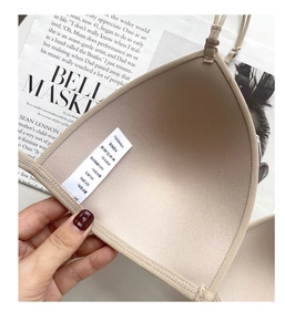 Detail of the nude seamless bra showing soft inner lining and fabric care label