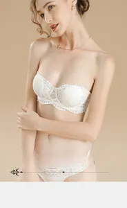 Detail of white French lace bra set featuring floral embroidery and anti-slip strapless design