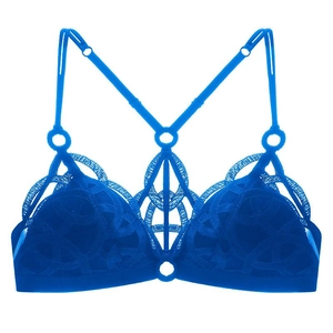 Detail of royal blue lace bralette featuring geometric embroidery and metal ring accents