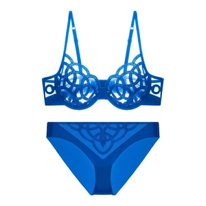 Detail of bright blue lace lingerie set featuring geometric mesh patterns and thin straps