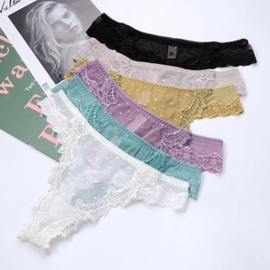 Flat lay of six colorful lace thongs with breathable dot mesh and floral embroidery