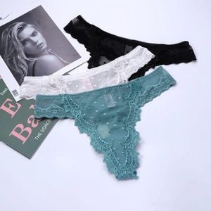 Detailed set of three lace thongs in black, white and teal with breathable mesh dots