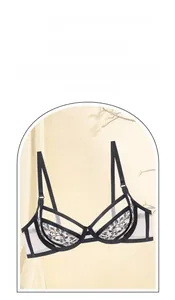 Detailed close-up of French embroidered black lace bra with breathable mesh cup design