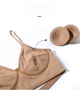 Detail view of seamless nude bra with removable round pads and thin shoulder straps