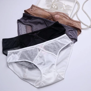 Detailed view of satin and dotted lace panties with overlapping cross-waist design