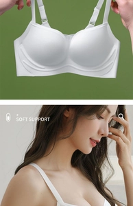 Detail of white seamless wireless bra featuring soft support technology and 3D molding