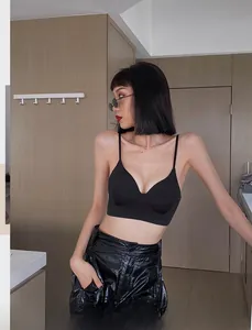 Detail of thin straps and V-neckline on a seamless black wireless French style bralette