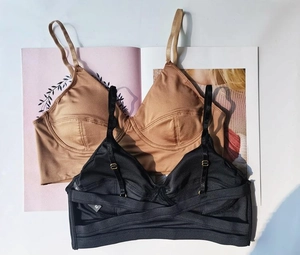Detail of thin straps and elastic band on French style seamless wireless bralettes