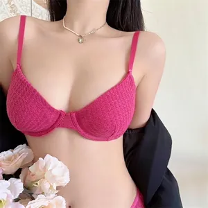 Hot pink lace lingerie set with underwire cups and crochet texture in a stylish fit