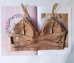 Detail view of camel cross-strap back on seamless non-wired bra with adjustable straps