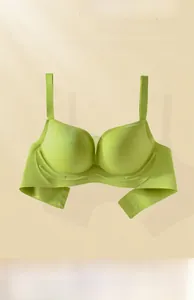 Detail of light green seamless wireless bra featuring soft support and smooth mesh texture