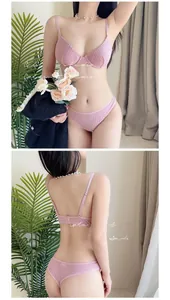 Detailed macro view of pink waffle textured lingerie set with fine shoulder straps