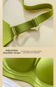 Detail of adjustable shoulder straps and elastic seamless fabric on green push-up bra
