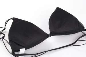 Detail of black triangle cup bra showing front buckle closure and thin straps
