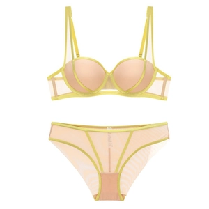 Detail view of push up bra set featuring beige cups and yellow mesh frame design