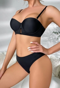 Detail view of black seamless push-up bra set featuring central cutout and thin straps