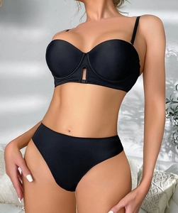 Detail view of black seamless lingerie set with plunging V-neckline and cutout design